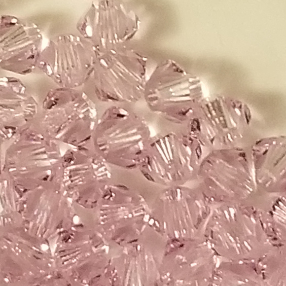 Swarovski Jewelry - 4/$75 Swarovski 3mm Bi-cone Violet Xilion Crystals